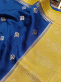 Close-up of a blue and yellow fabric with intricate patterns