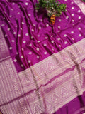 Purple saree with white patterns on a plain background