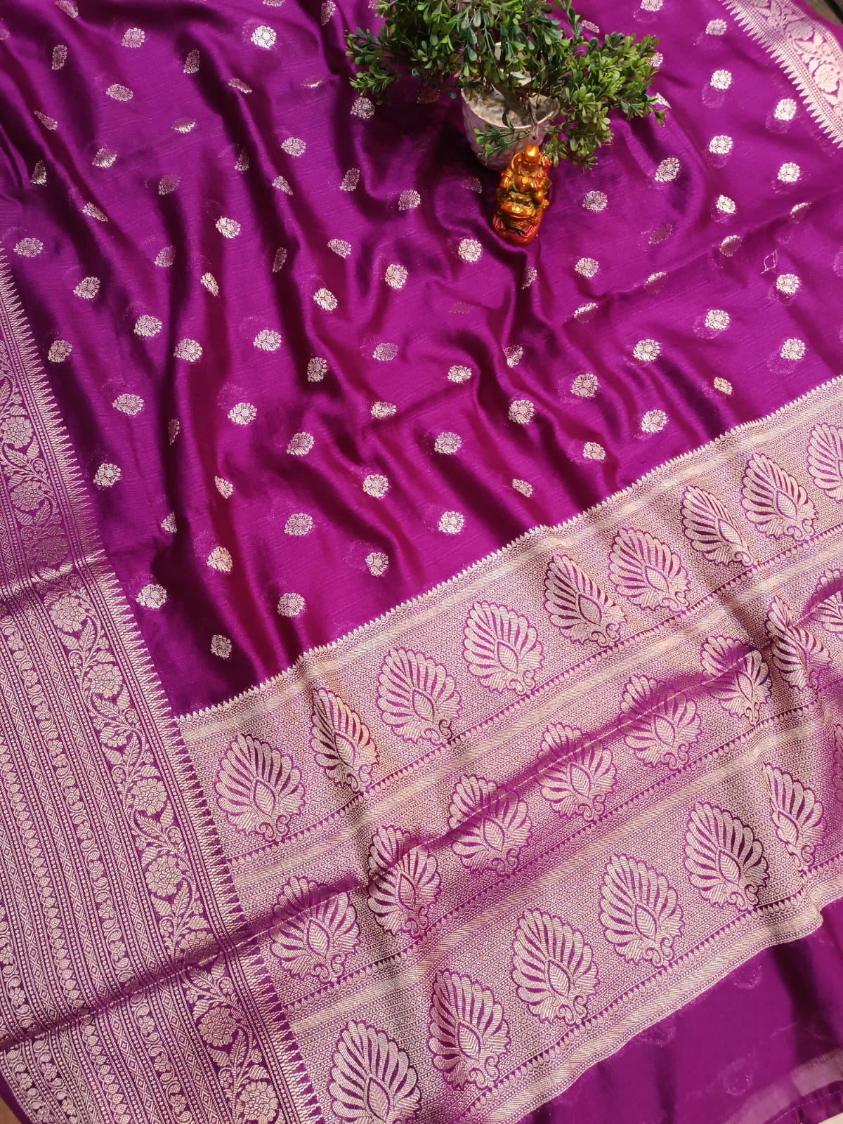 Purple saree with white patterns on a plain background